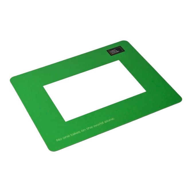 A green mouse mat featuring a rectangular cutout in the centre and a logo in one corner.