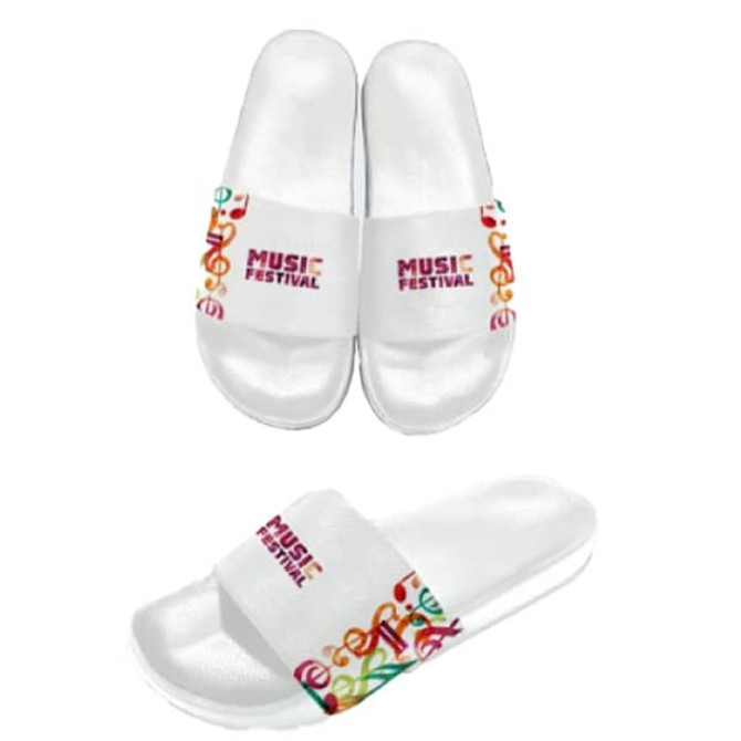 A pair of white slide sandals featuring a colourful design and a logo on the straps.