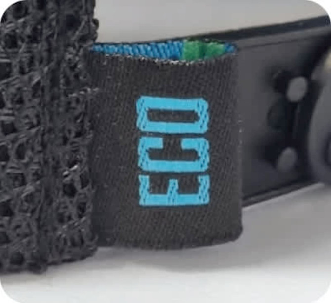 A black cap featuring a breathable mesh back and a tag with "ECO" branding.