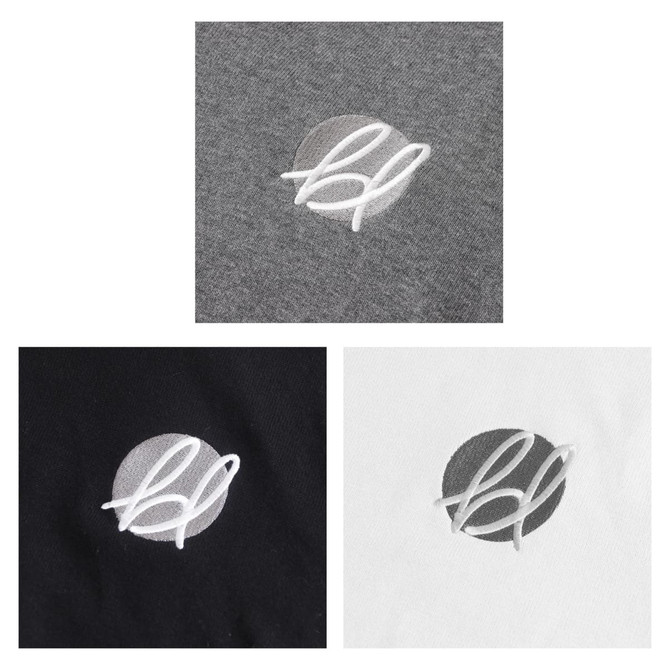 Three turtleneck sweaters in black, white, and grey, each featuring an embroidered logo.