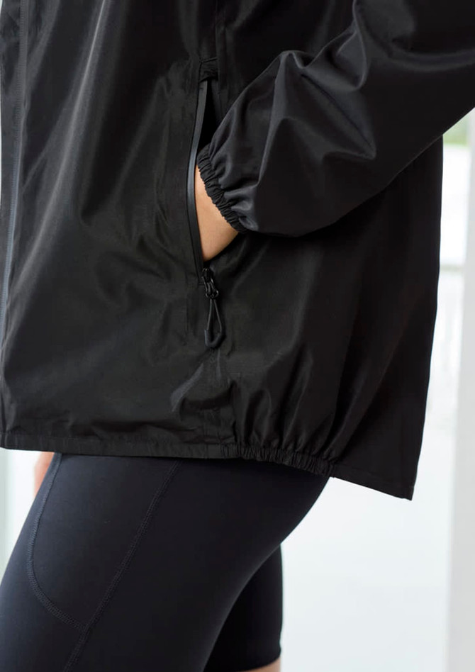 A black women's rain jacket features elastic cuffs and a side pocket, designed for comfort and style.