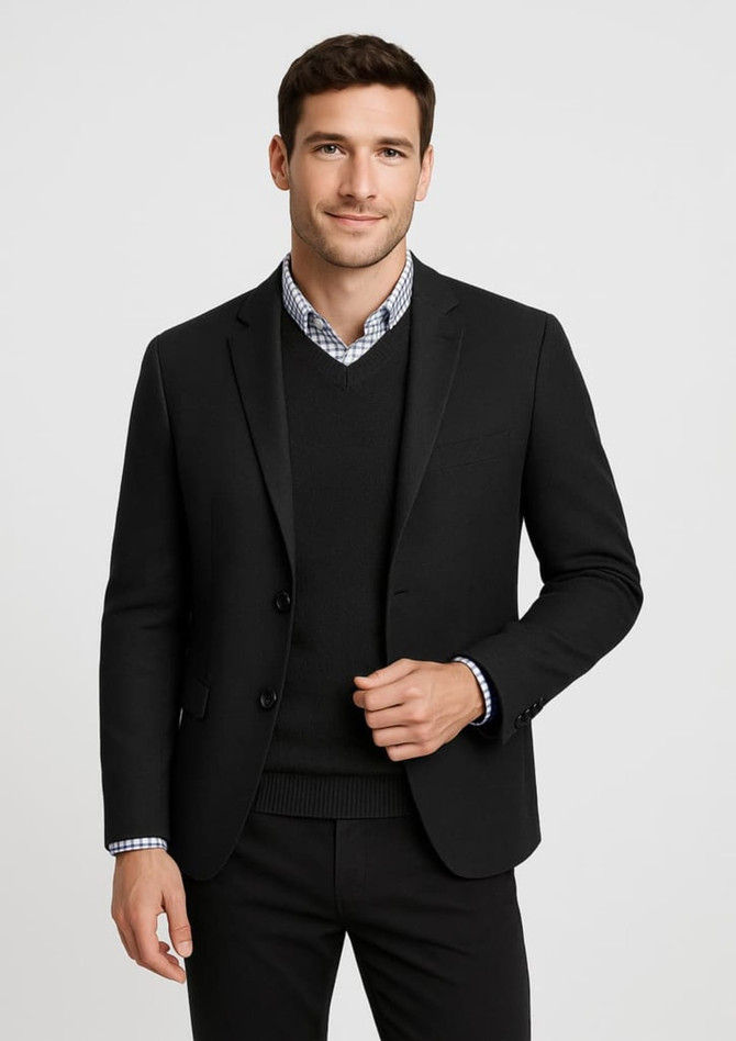 A tailored black suit jacket worn over a black knit jumper, paired with a checkered shirt underneath.