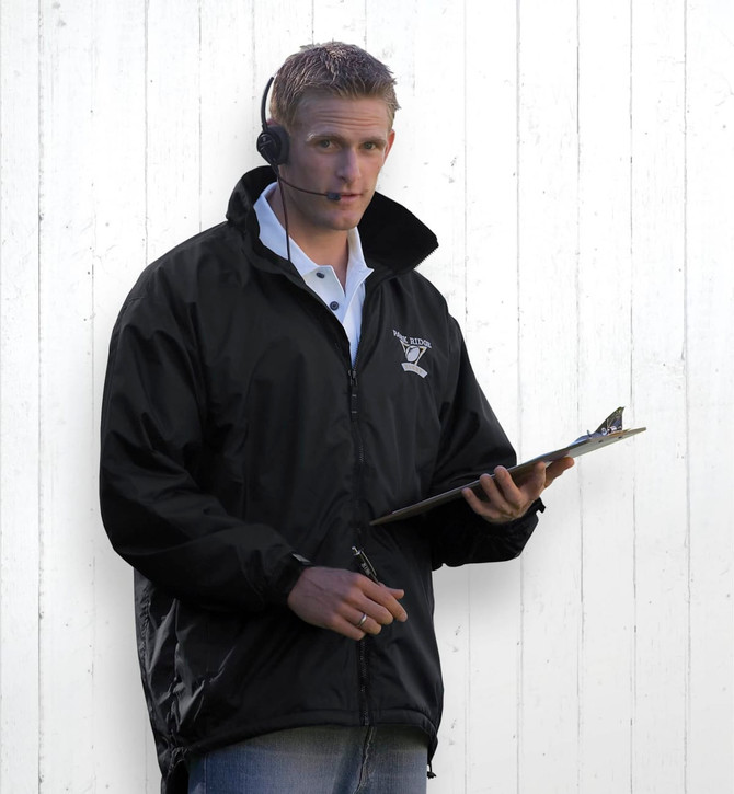 A black Manager's Jacket worn by a man holding a clipboard, with an earpiece and casual attire.