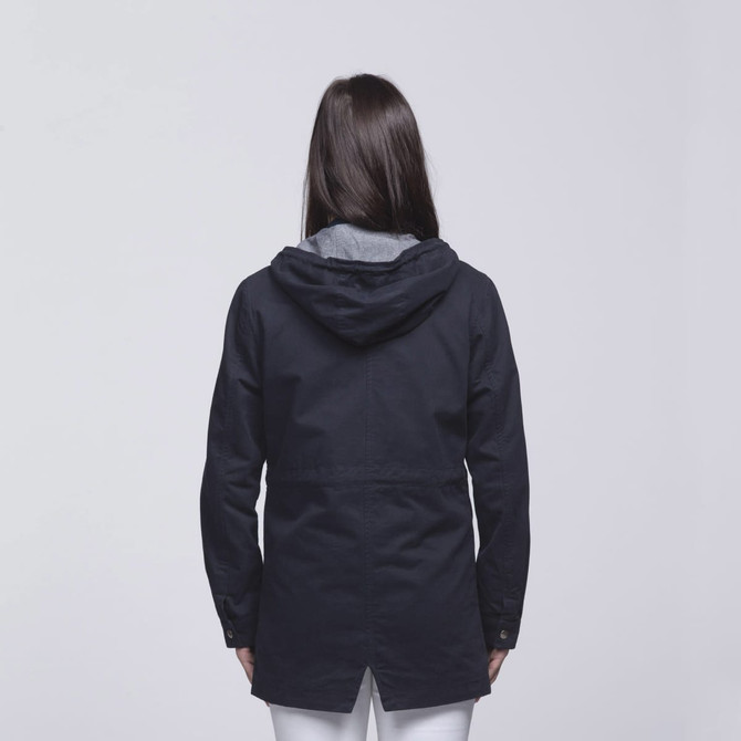 A navy twill jacket featuring a hood and grey lining, seen from the back. Includes a logo.