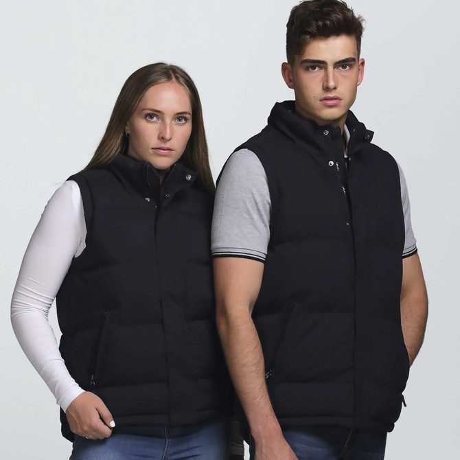 A black puffa vest is displayed on two individuals, featuring a zip-up design and pockets.