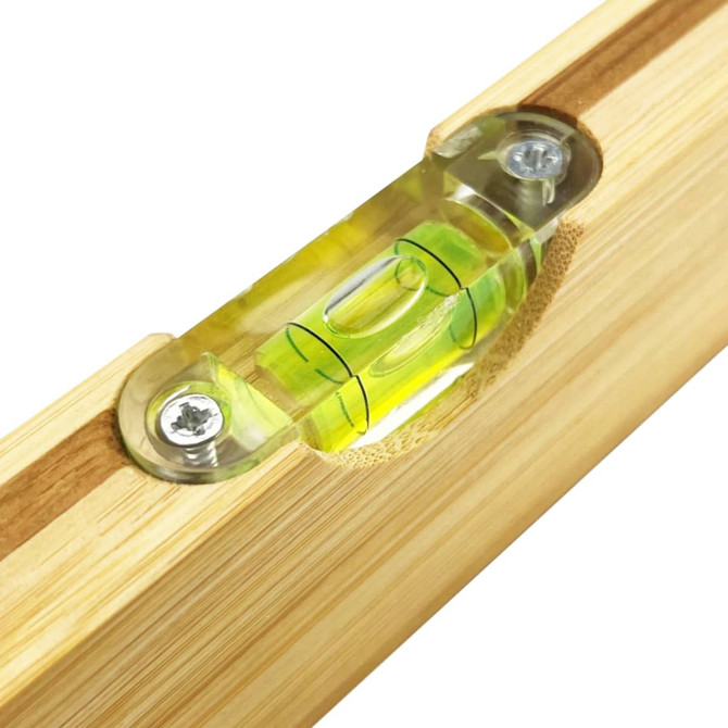 A drink bottle opener leveller made of bamboo, featuring a green spirit level. It has a simple, natural design.