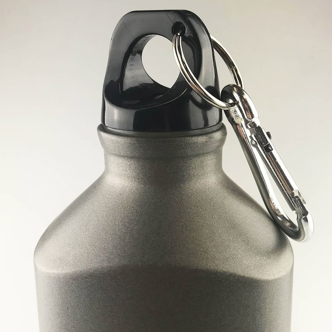 A drink bottle in matte grey with a black top and attached carabiner for convenient carrying.