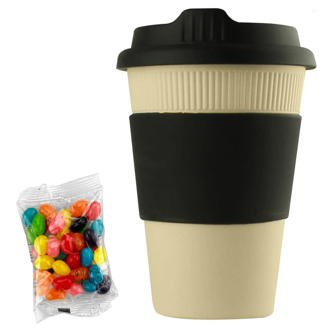 A reusable 12oz bamboo coffee cup in cream with a black sleeve, accompanied by a bag of colourful jelly beans.
