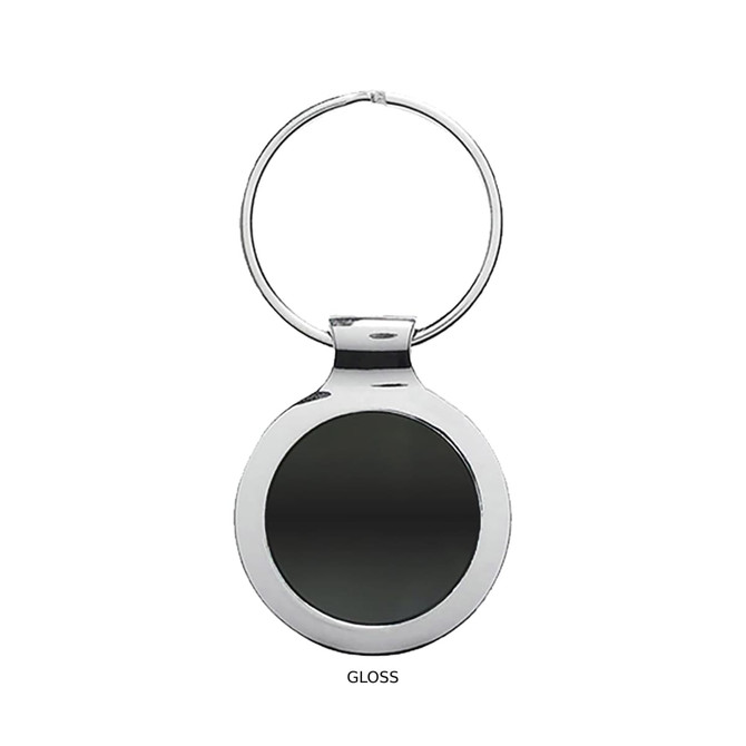 A glossy silver key ring featuring a round, reflective disc in the centre.
