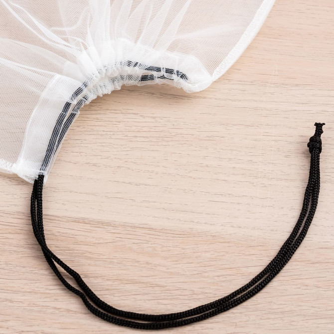 A white nylon mesh produce bag with a gathered top and a black drawstring for closure.