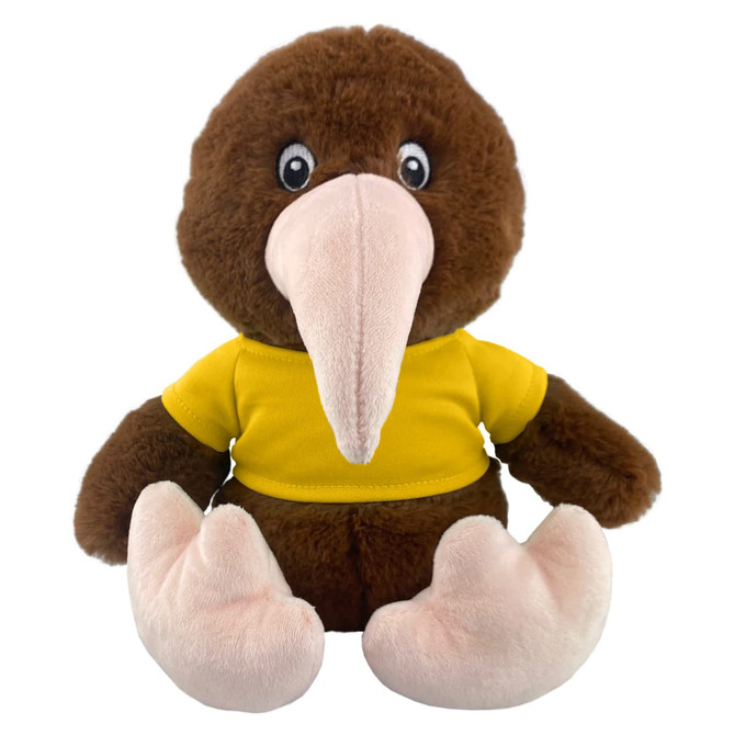 A plush kiwi toy with brown fur and a yellow shirt, featuring large eyes and soft pink feet. It has a logo on it.