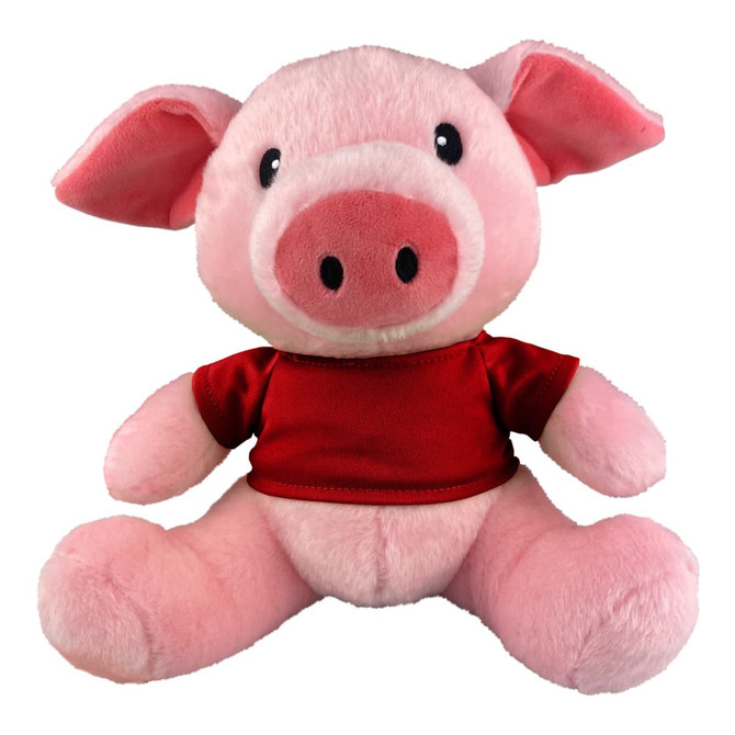 A pink pig plush toy wearing a red shirt, with large ears and a smiling face. It has a logo on the shirt.