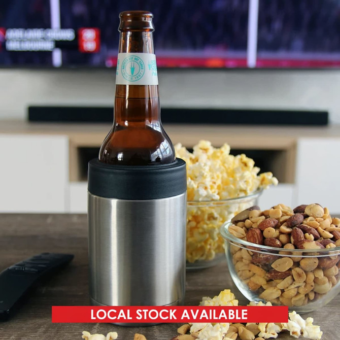 A stainless steel stubby holder in silver, holding a bottle, surrounded by snacks including popcorn and nuts.