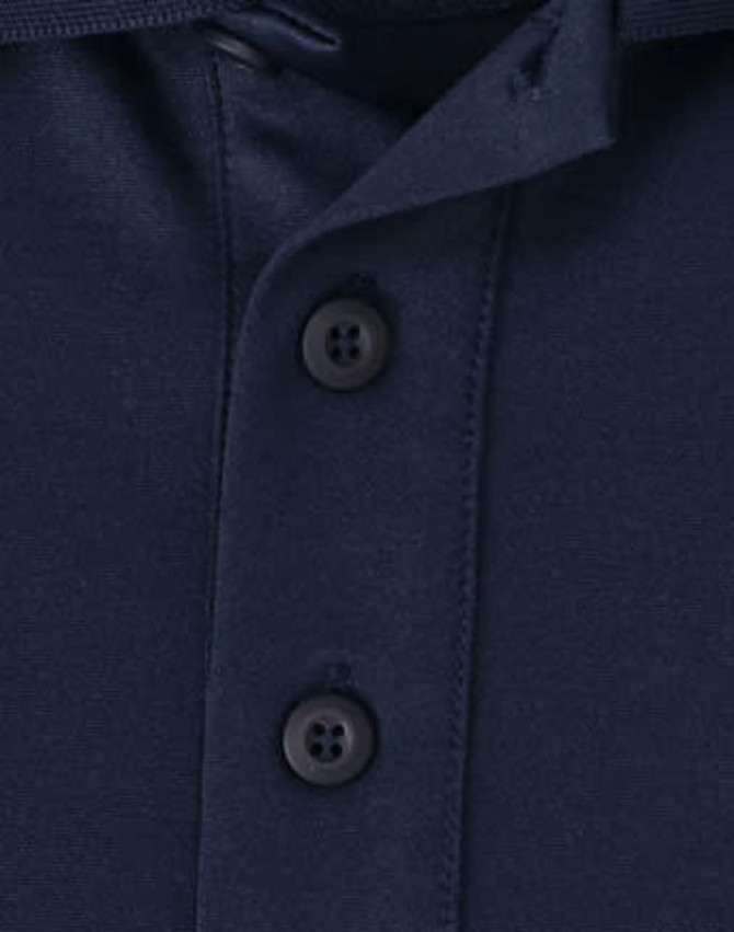 A close-up of a navy men's polo shirt featuring a button placket and collar. The fabric appears soft and sustainable.