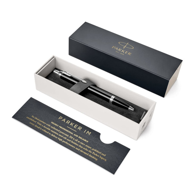 A black lacquer metal ballpoint pen displayed in a box, featuring a branded interior design.