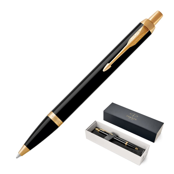 A ballpoint pen in lacquer black with gold accents, presented in a black box featuring branding.