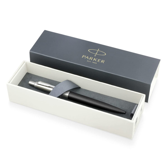 A metal ballpoint pen in matte black, presented in a stylish box with a logoed lid and grey cushioning.