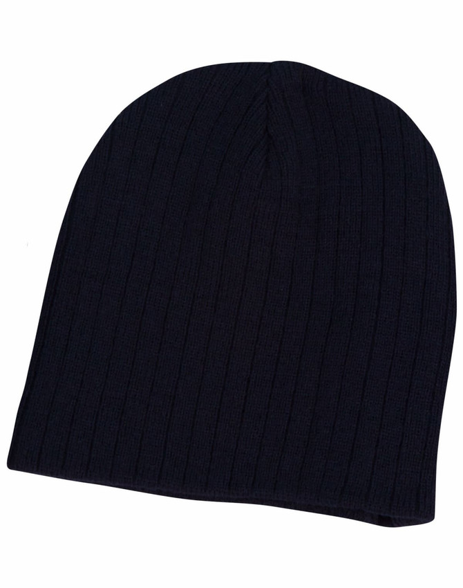 A navy cable knit beanie with a ribbed texture, featuring a logo on one side.