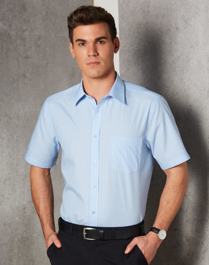 A light blue men's pin stripe short sleeve button-up shirt featuring a chest pocket and a logo.