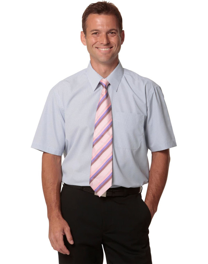A light blue short-sleeve button-up shirt worn by a man, paired with a pink striped tie and black trousers.