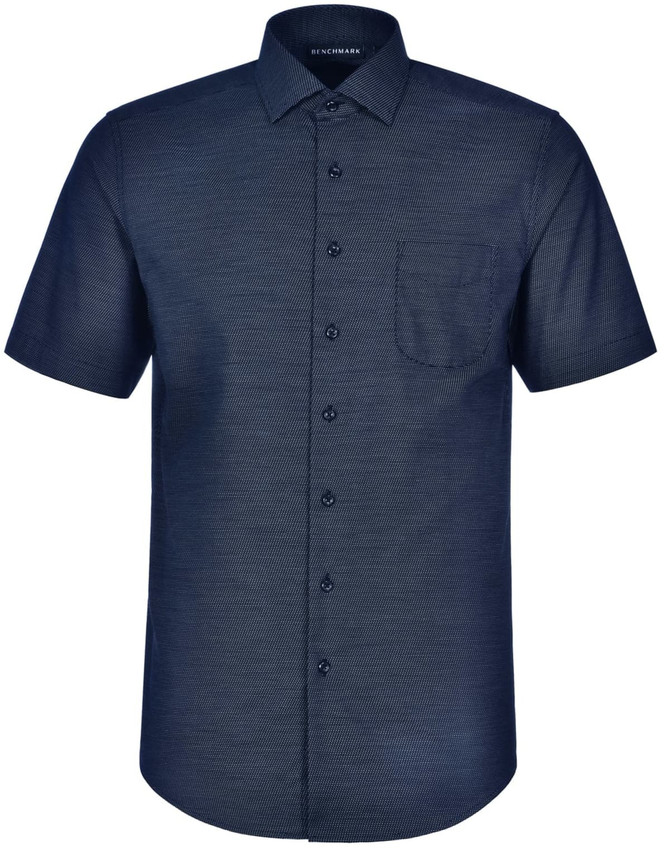 A short-sleeved button-up shirt in navy with a pin dot pattern and a chest pocket. Features branding on the collar.