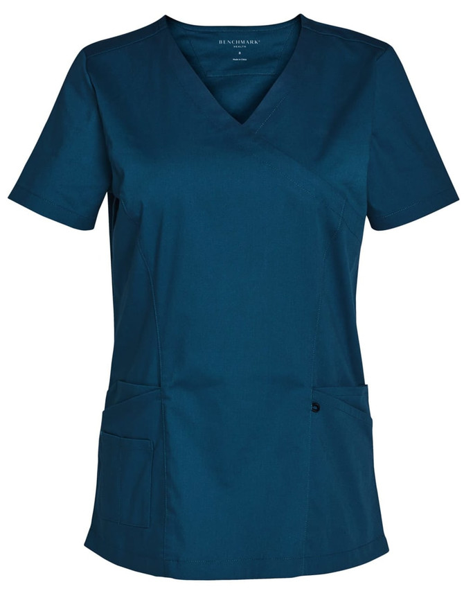 A solid colour short sleeve scrub top in teal with a v-neck design and two front pockets.