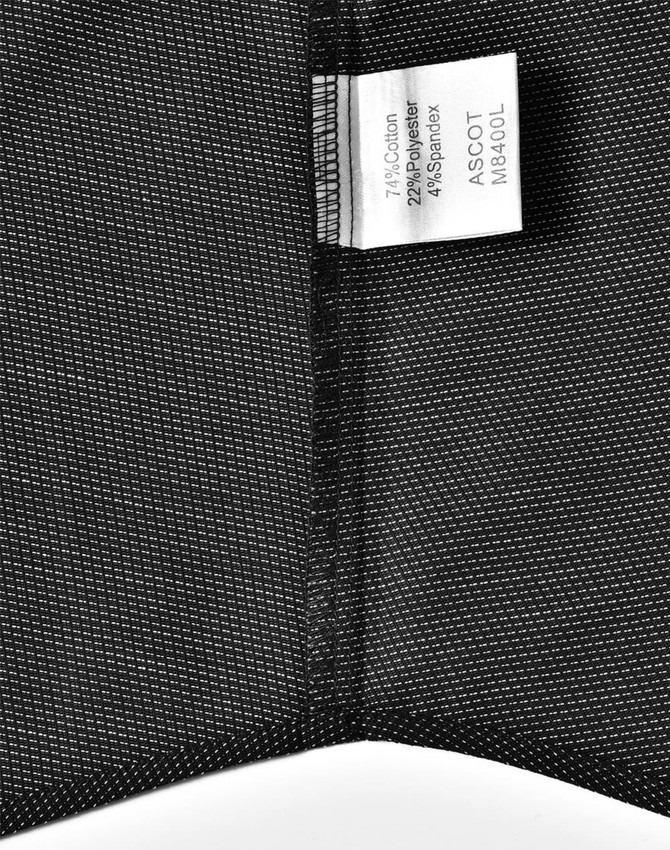 A black fabric swatch with a pin dot pattern, featuring a label with material information and a logo.