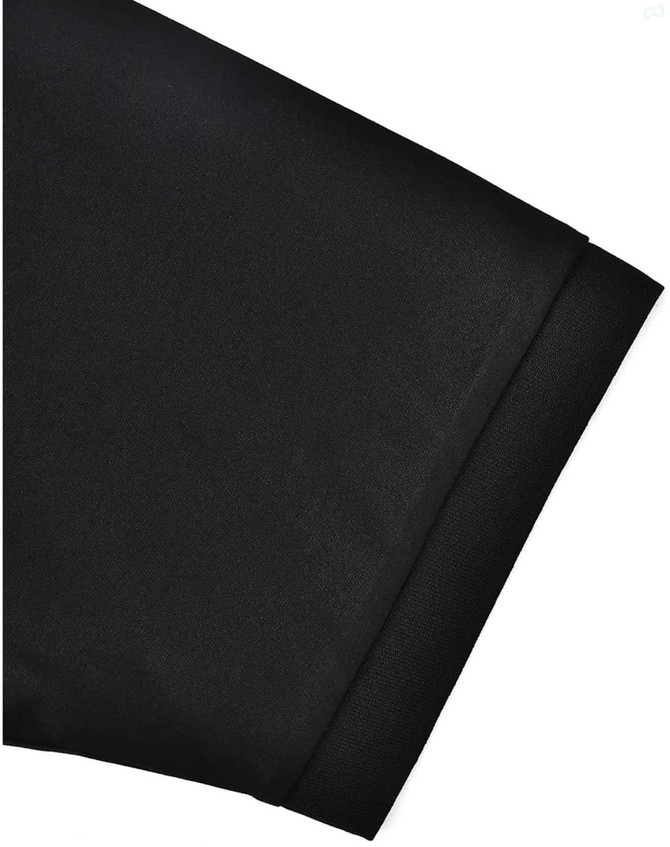 A close-up of a black sustainable poly/cotton polo shirt sleeve featuring a plain finish and a cuff.