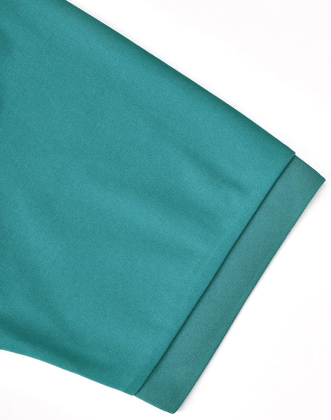 A close-up of a teal men's sustainable poly/cotton polo shirt sleeve with a branded label.