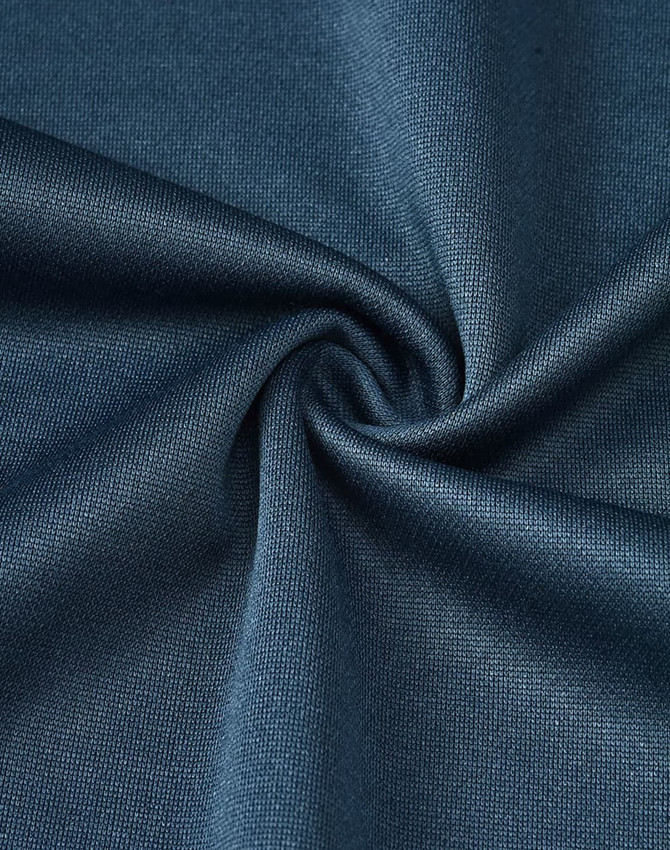 A close-up of dark blue poly/cotton fabric, showcasing a smooth and even texture, ideal for polo shirts.