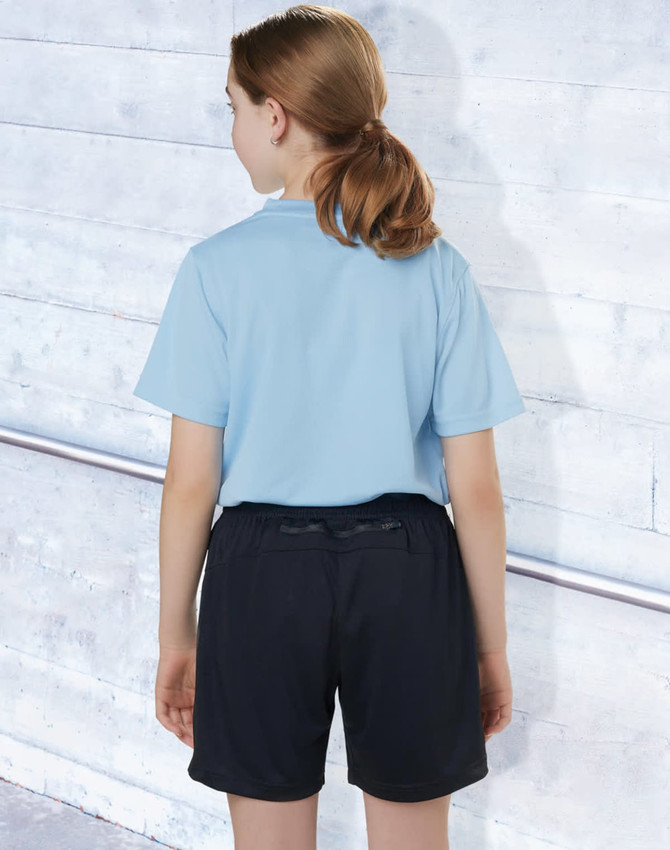 Black sports shorts made from bamboo charcoal, worn by a child in a light blue shirt, facing away from the camera.