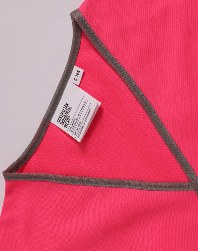 A pink safety vest with grey trim and a label attached at the neckline.