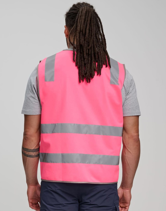 A pink safety vest with grey reflective tapes, featuring a logo, designed for high visibility.