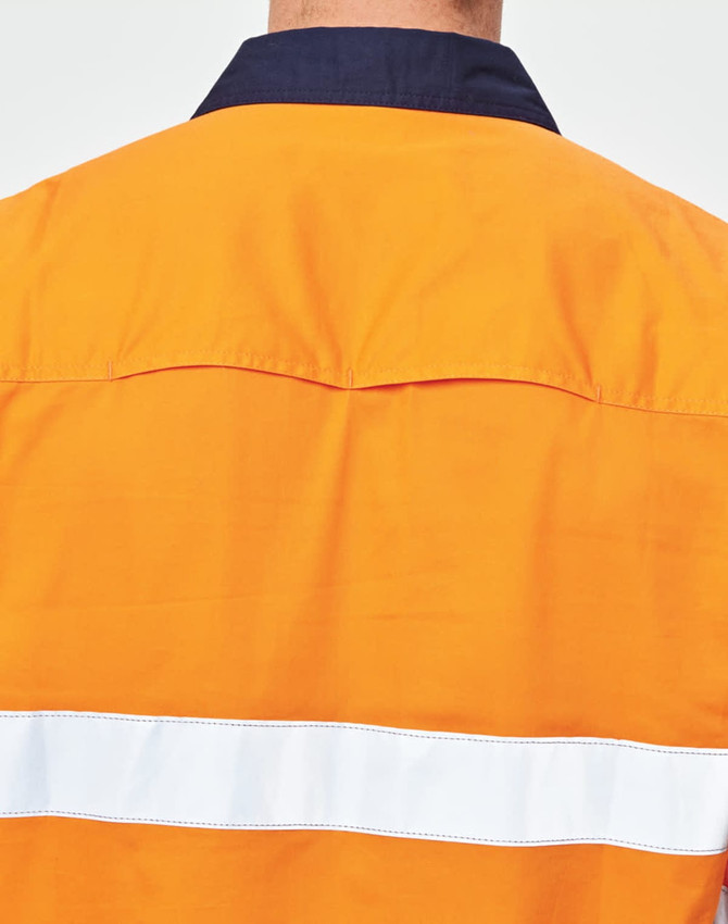 A safety shirt in orange with a navy collar and reflective white tape on the back. It features a logo.