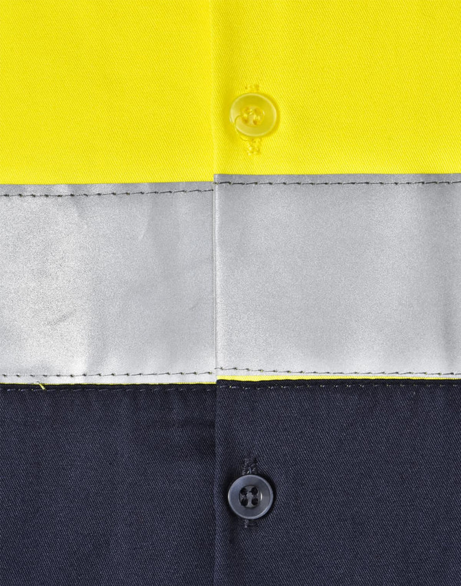 A high-visibility long-sleeve safety shirt featuring yellow fabric with grey reflective tape and dark navy sections.