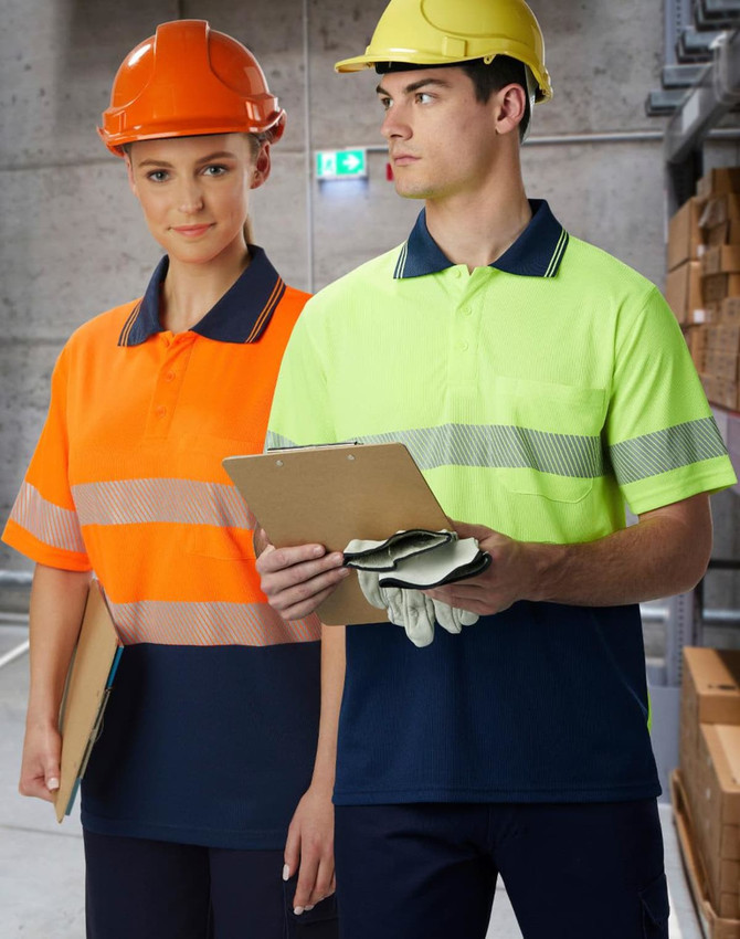 Unisex Cooldry Segmented Safety S/S Polo in orange and yellow, modelled by two people wearing safety helmets.