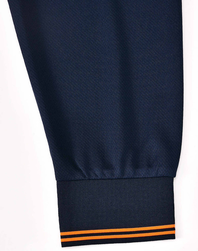 A navy blue long-sleeve polo shirt featuring an orange striped cuff and a logo or branding on the fabric.