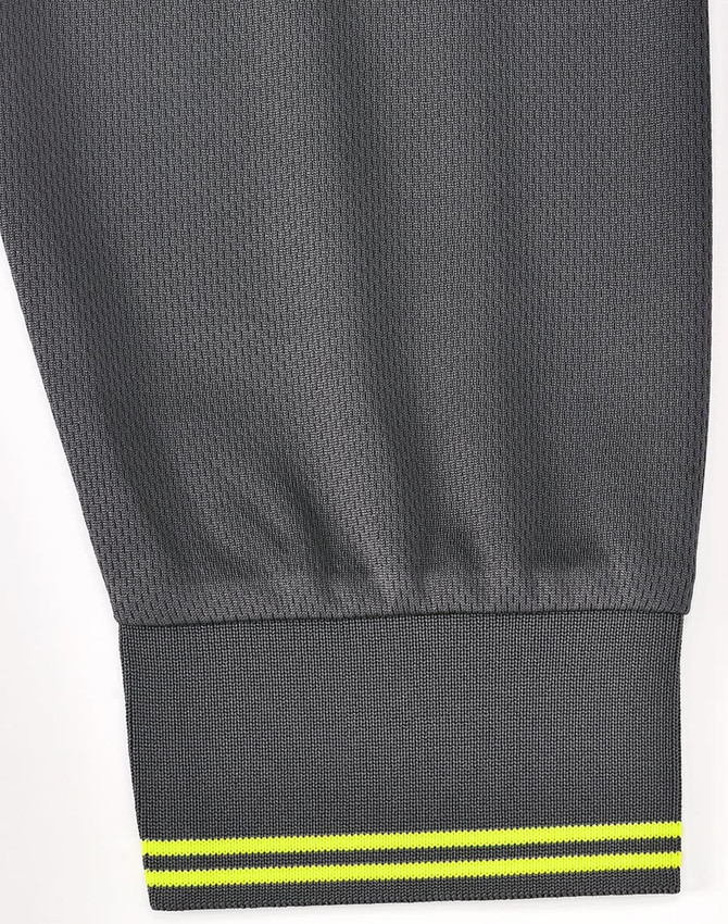A long-sleeve grey polo shirt featuring a segmented hem with a yellow accent stripe and a logo.