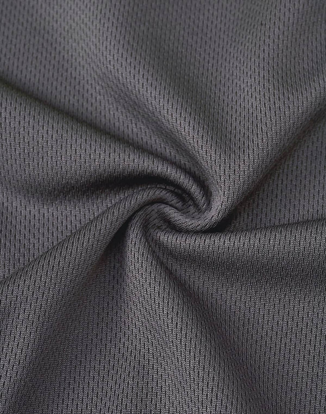 A close-up of dark grey, textured fabric showcasing a breathable mesh design, suitable for work polo shirts.