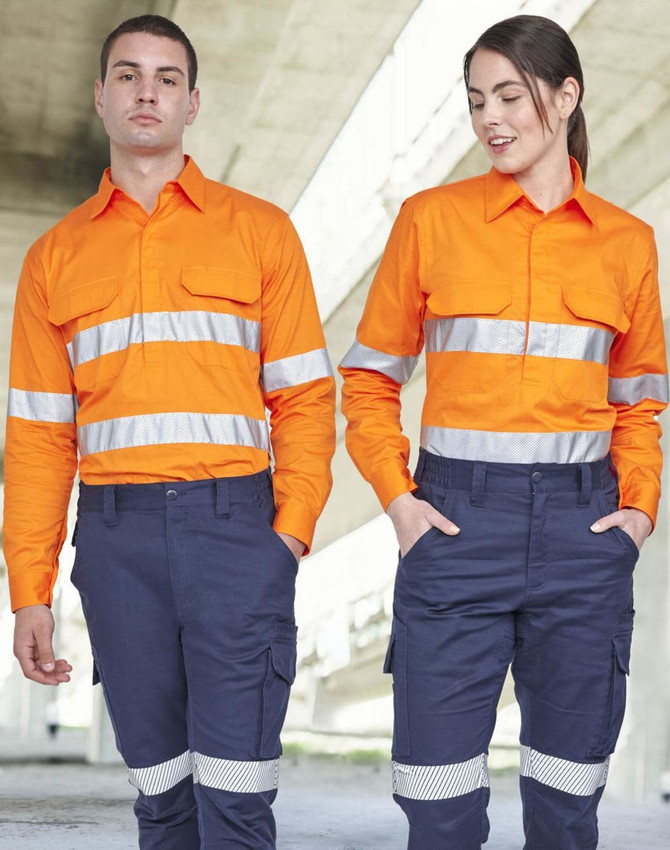 Hi Vis long-sleeve shirt in orange with reflective tape, worn by two models standing outdoors in navy pants.