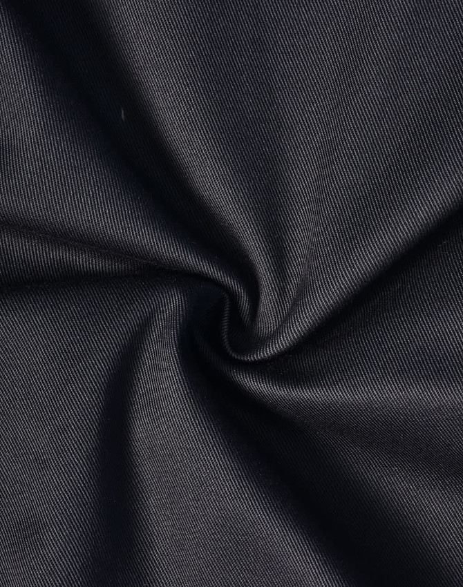 A close-up of black fabric, featuring a smooth, durable texture suitable for cargo pants.