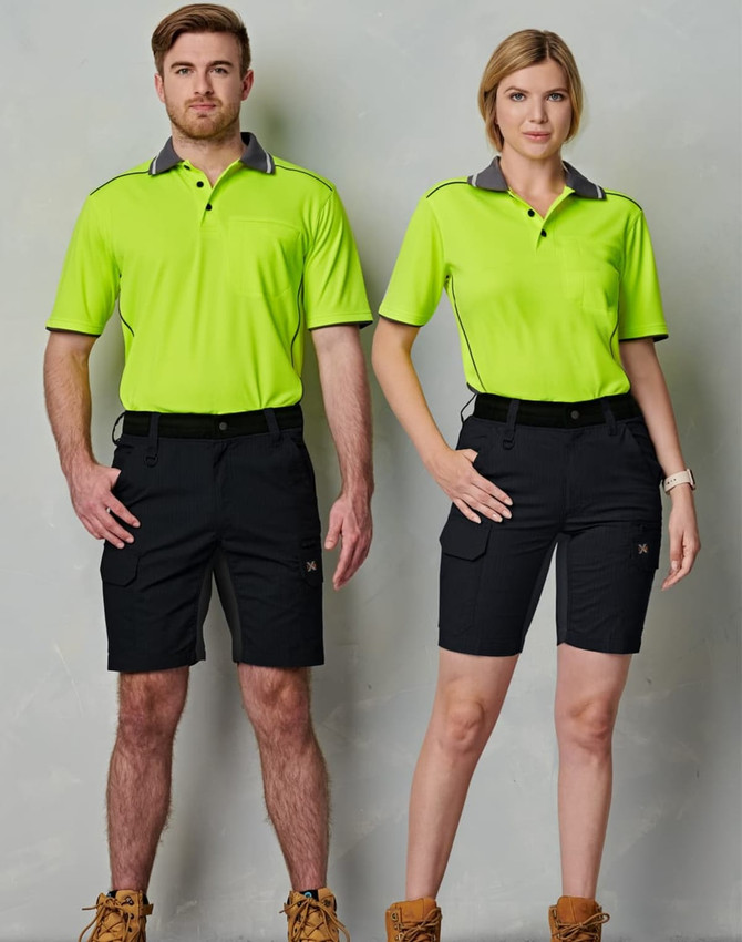 A pair of models wearing bright green polo shirts and black Rip-Stop Poly/Cotton Stretch Work Shorts.