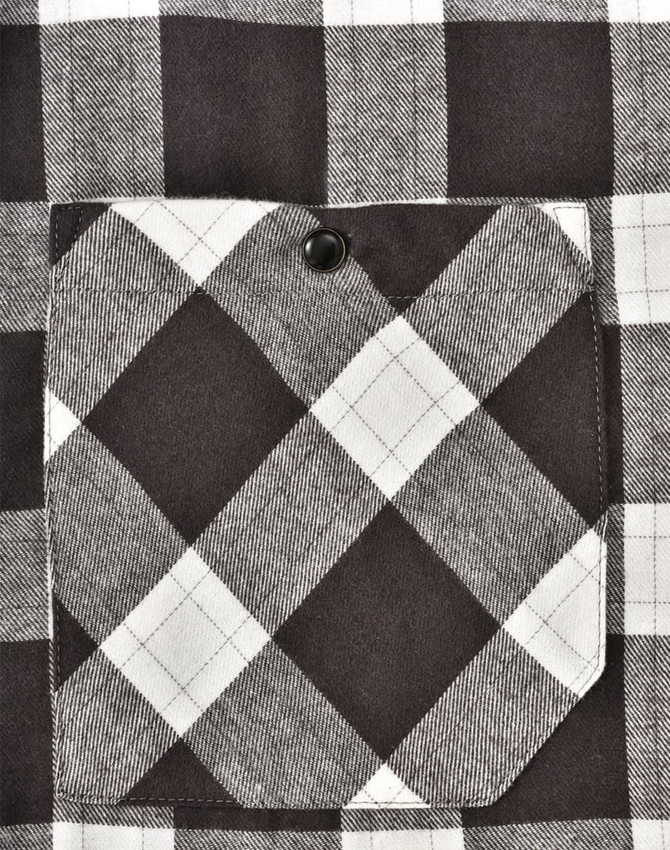 A black and white checked flannel plaid shirt featuring a chest pocket with a button. The fabric has a soft texture.