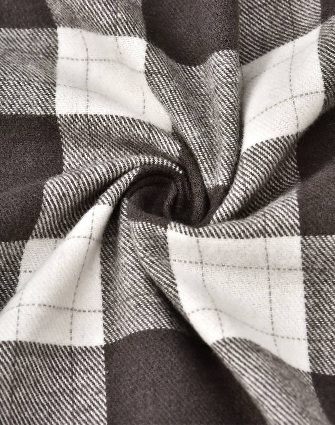 A close-up of grey and white flannel fabric with a plaid pattern, showing the texture and weave.