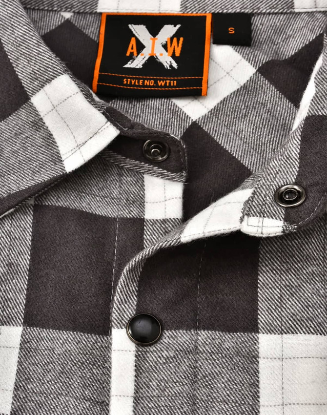 A black and white plaid unisex flannel button-up shirt featuring a collar and branded tag.