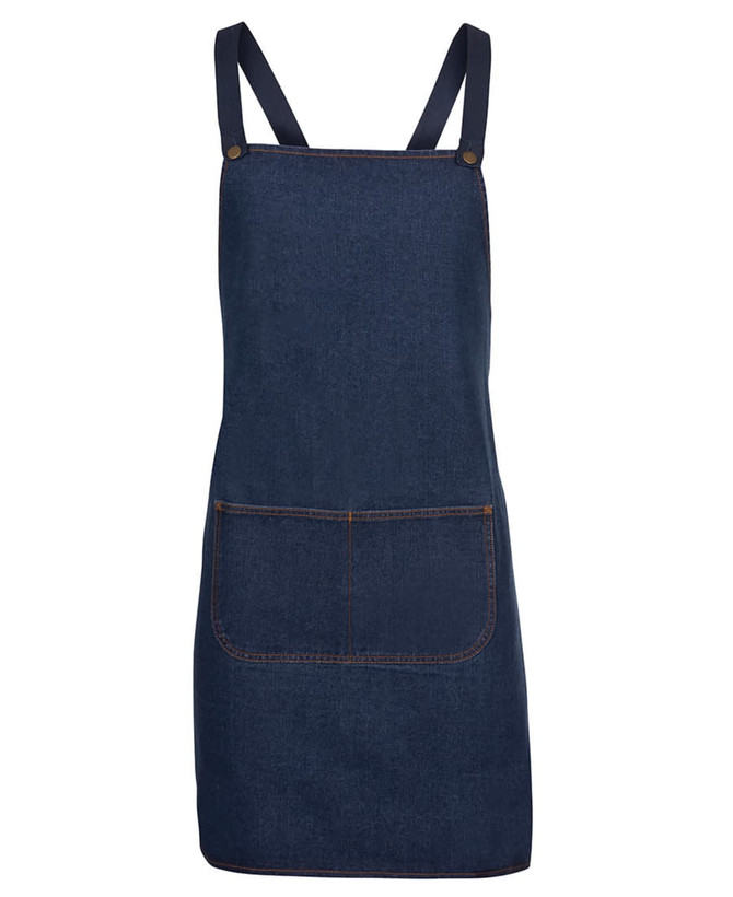 A navy denim cross back apron featuring adjustable straps and a front pocket. It has a simple design and a branded logo.