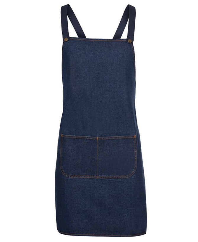 A dark blue denim apron with cross back straps and a front pocket, featuring metal buttons.