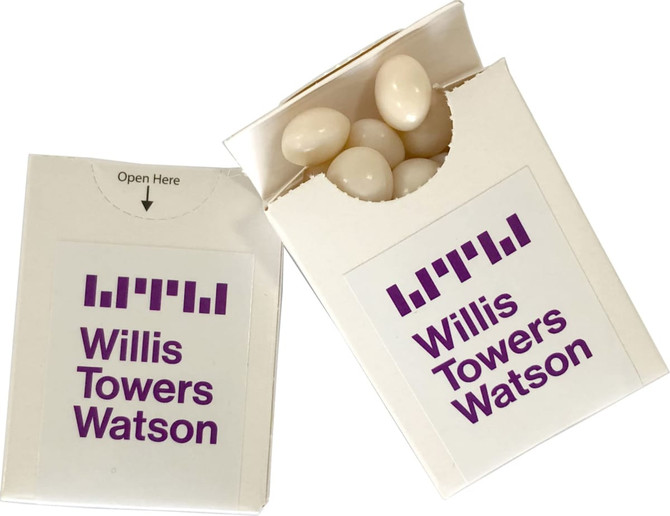 A white flip lid cardboard box filled with white mints, featuring a logo on the front.