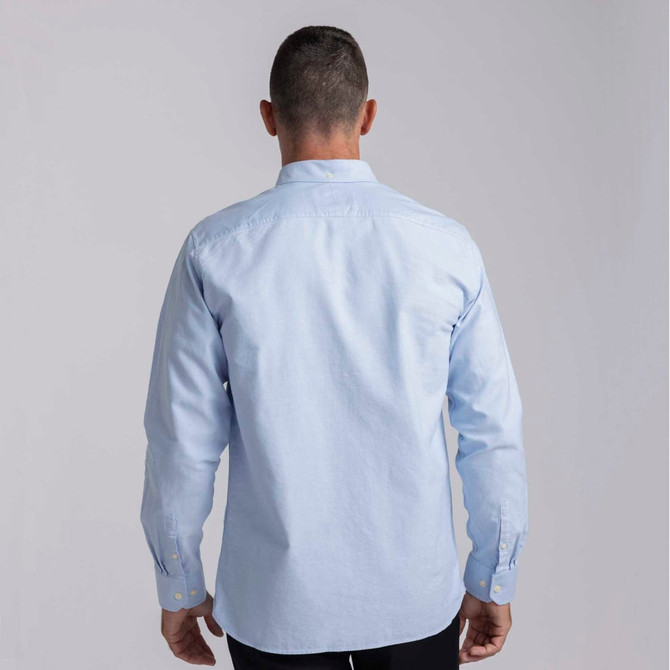 A light blue men's button-up shirt with long sleeves and a logo on the back.