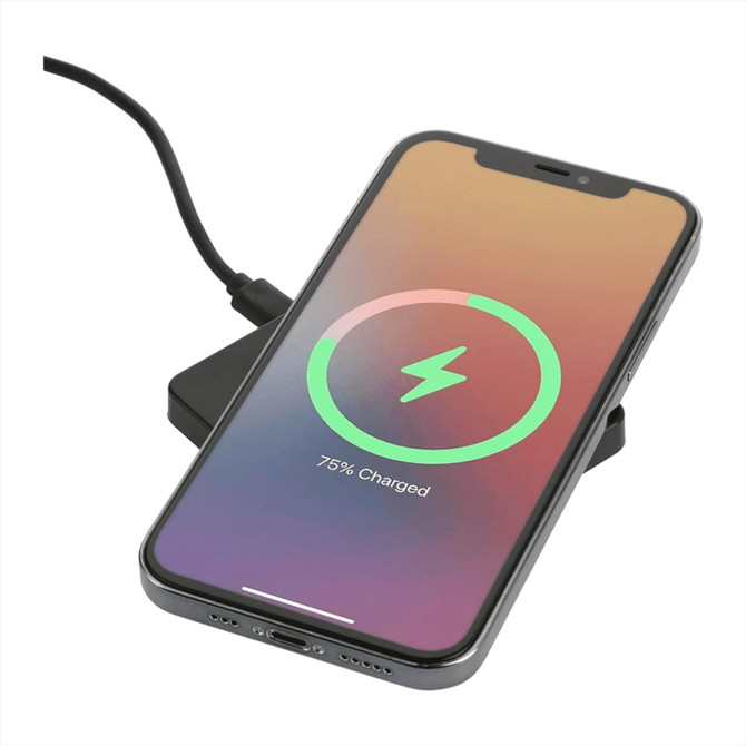 A black square wireless charging pad with a phone displaying a charging icon.